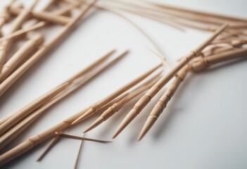 Wooden knitting needles on white background as frame