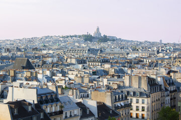 Fototapeta na wymiar View of the city of Paris with the Church of the Sacred Heart in the background on the Montmartre hill