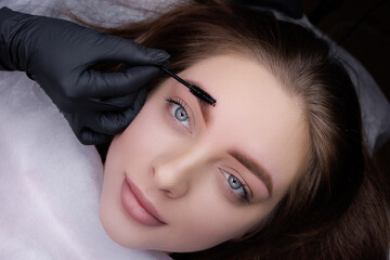 Eyebrows of a young girl after permanent eyebrow makeup procedure. PMU Procedure, Permanent Eyebrow Makeup.