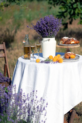lemonade, croissants and apricots on a table in the garden - 726494637