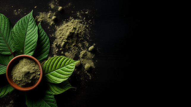Mitragyna speciosa (kratom) leaves with powder in the wooden cup on black background