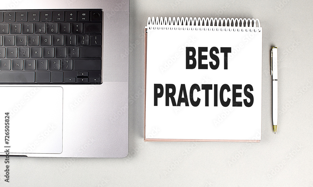 Poster best practices text on notebook with laptop and pen