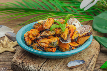 Mussels with oil, spices and greens. Healthy seafood is rich in omega. Marine decor