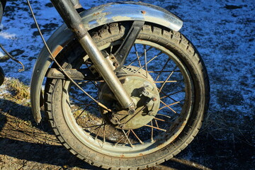 one front old retro   wheel with fork part and gray   color front iron fender of old classic...