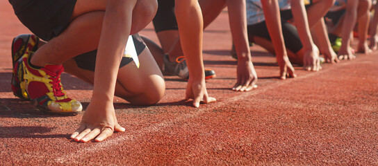 Cropped image of a sprinter getting ready to start at the stadium