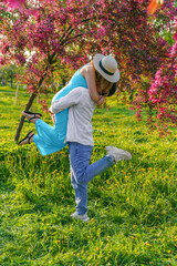 young couple dances, embraces, and revels in each other's company amidst a vibrant spring park....