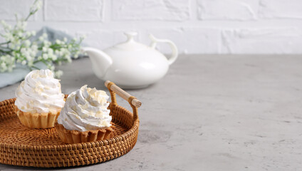 Fototapeta na wymiar mini cake basket with meringue cream