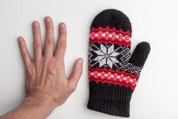 А Bare Hand and Winter Mitten