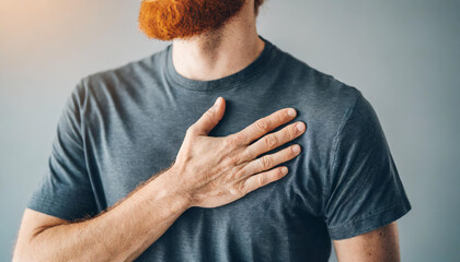 person's hand placed tenderly over their heart, expressing emotions of love, care, or sincerity