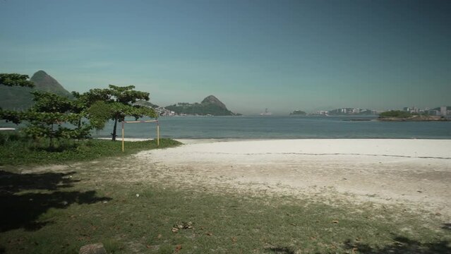 View of Charitas beach, on the Niter&oacute;i waterfront, bathed by the waters of Guanabara Bay and, in the background, the Tijuca mountain range, Rio de Janeiro, Brazil
