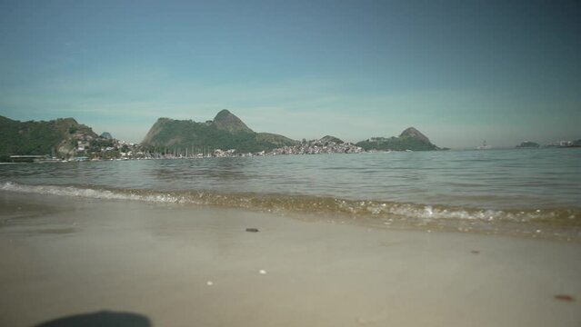 View of Charitas beach, on the Niter&oacute;i waterfront, bathed by the waters of Guanabara Bay and, in the background, the Tijuca mountain range, Rio de Janeiro, Brazil