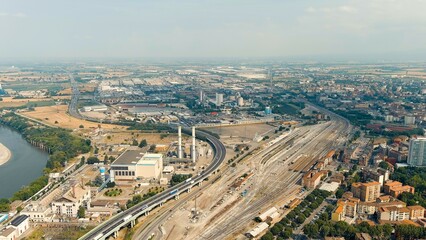 Piacenza, Italy. Industrial area with highway and railway station. Po River. Summer day, Aerial View