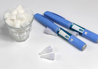 Hands in surgical gloves holding Ozempic Insulin injection pen for diabetics.