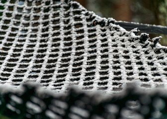 abstract snowy net texture, white net in winter