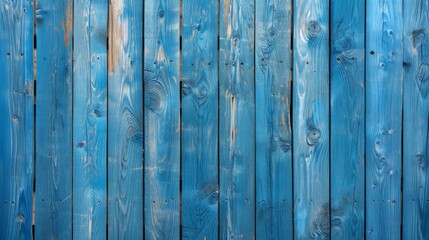 Vibrant blue painted wooden planks with natural wood grain texture, suitable for backgrounds and design elements.