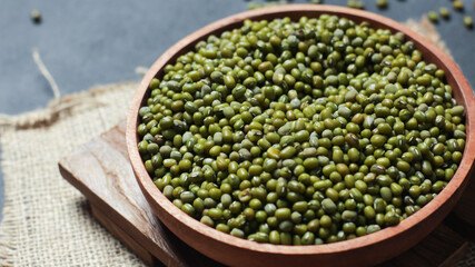 Close-up of mung beans on wooden plate