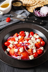 tomato salad with red onion and white cheese