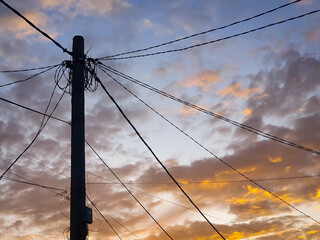 Power electric pole with line wire on colored background close up. Photography consisting of power...
