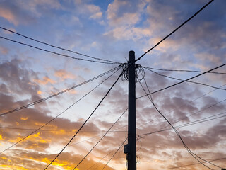 Power electric pole with line wire on colored background close up. Photography consisting of power...