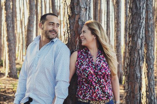Happy multicultural couples in the wood