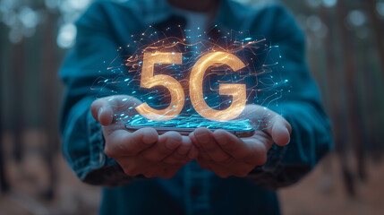 5G connectivity concept. Two hands holding a mobile device with words 5G forming above it.