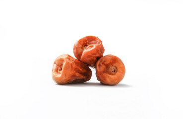 Dried dates fruits isolated on white background.