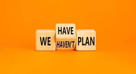 We have or not plan symbol. Concept word We have or have not plan on beautiful wooden cubes. Beautiful orange table orange background. Business and we have or not plan concept. Copy space.
