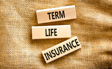 Term life insurance symbol. Concept words Term life insurance on beautiful wooden blocks. Beautiful...