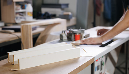 Process Gluing edge on machine to chipboard laminate board for production furniture in wooden...