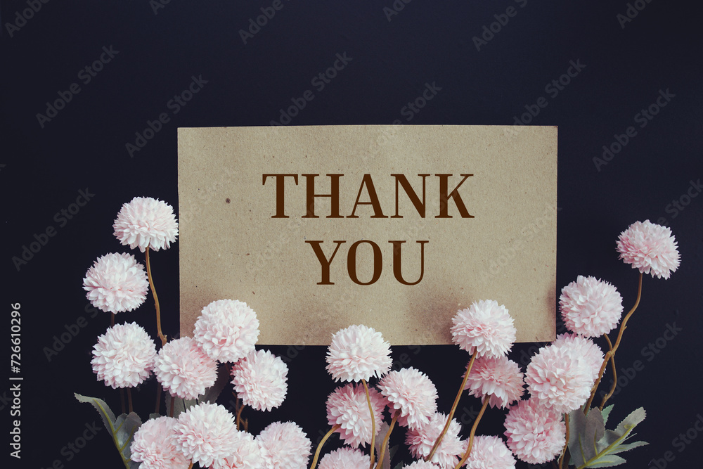 Wall mural thank you text message with flower decoration on wooden background - Wall murals