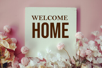 Welcome Home text message with flower decoration on pink background