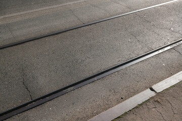 public transport, particular public transport lane of asphalt with tram lines, with rails embedded in the asphalt, for the transit of public transport by road together with tram vehicles.