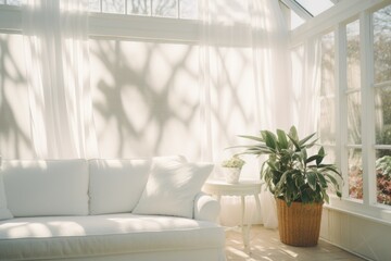 A white couch sitting in a living room next to a window. Perfect for interior design inspiration