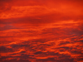 Sunset in the mountains with orange red sky and clouds. Winter Carpathian Mountains view...