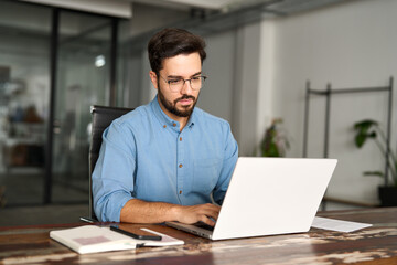 Busy professional business man company employee, young male worker software developer, latin...