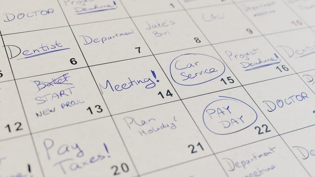 Calendar of a busy businessman full of many events and meetings.