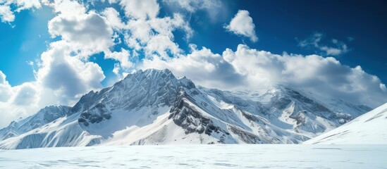 Obraz premium High mountain with withe snow and blue sky landscape. AI generated image