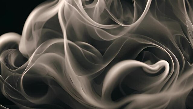 Intricate and hypnotic smoke patterns twisting and turning in a hypnotizing way. Abstract motion background