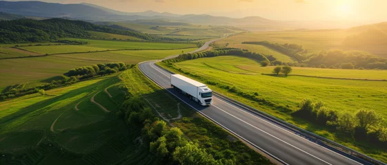 Deurstickers Truck on an open road through vibrant green fields, symbolizing logistics and freedom of travel © Ai Studio