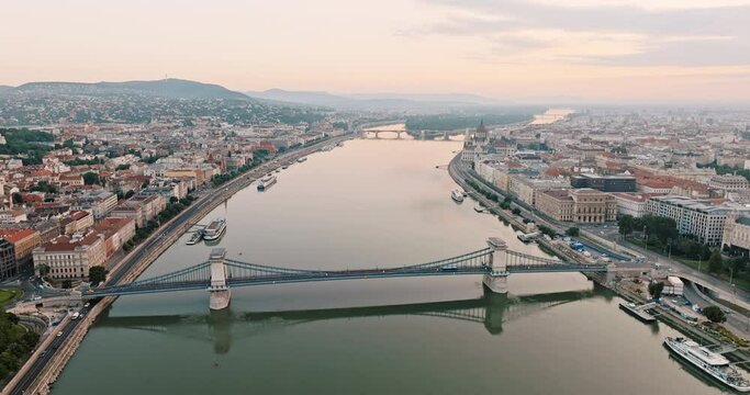 Danube River Chain Bridge aerial view on sunset summer slide back connects two historical parts panorama Budapest, Buda Pest. First permanent bridge over Danube. Travel destination concept. Tourism 