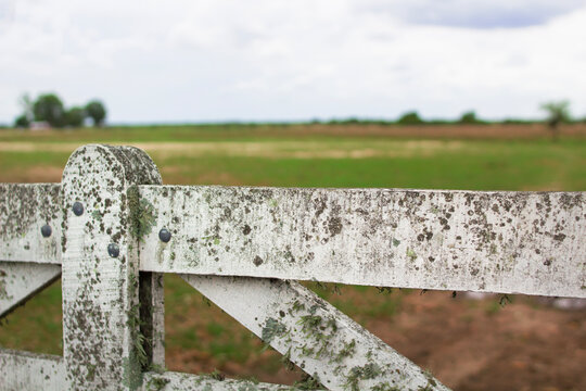 Rusty wooden gate at the entrance to a farm in Entre Rios, Argentina