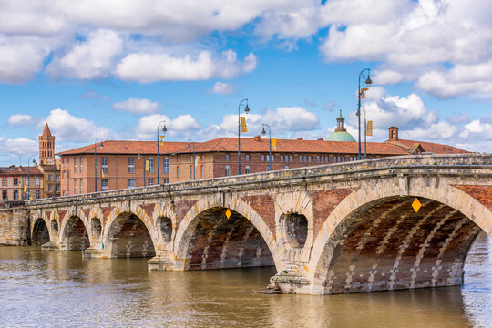 Scenic view of old bridge in Toulouse against spring dramatic sky
