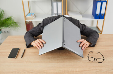 Young office employee gets stressed because of overworking, problems with computer and lack of...