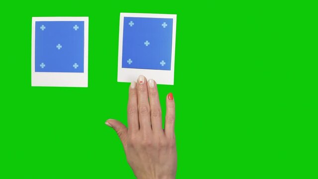 Placing Instant Photo Frames with trackers Female Hand. Prekeyed Solid Green screen. 2 sets by 3 frames  with placing and removing.
