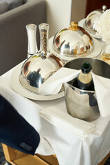 Waiter delivers restaurant food to a hotel room