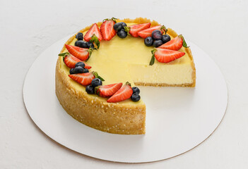 cheesecake with berries on a white background