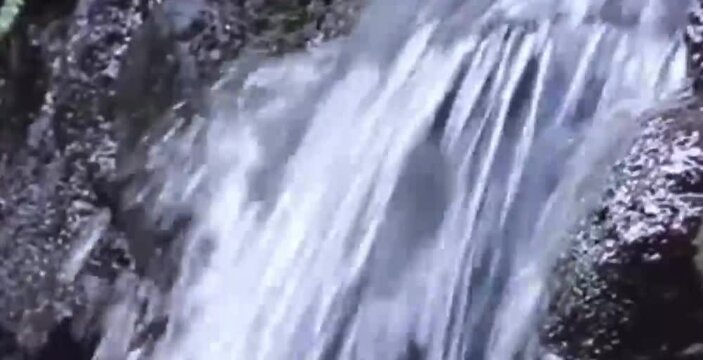 clear and natural river water flowing in rural nature