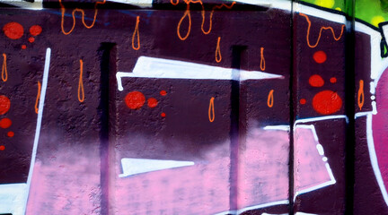 Colorful background of graffiti painting artwork with bright aerosol outlines on wall. Old school...