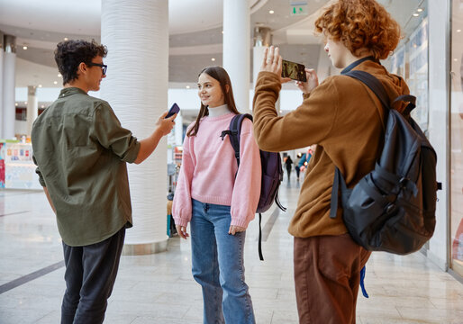Teenager friends recording interview streaming live video from shopping mall