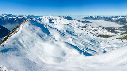 Aerial drone view of snow covered ski slopes at Stoos,Switzerland - obrazy, fototapety, plakaty